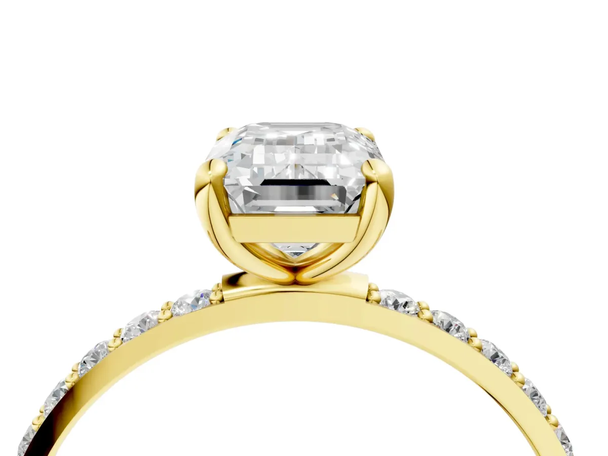 Emerald Cut Diamond Solitaire Ring with Round Pavé Band and Prong Setting Yellow gold
