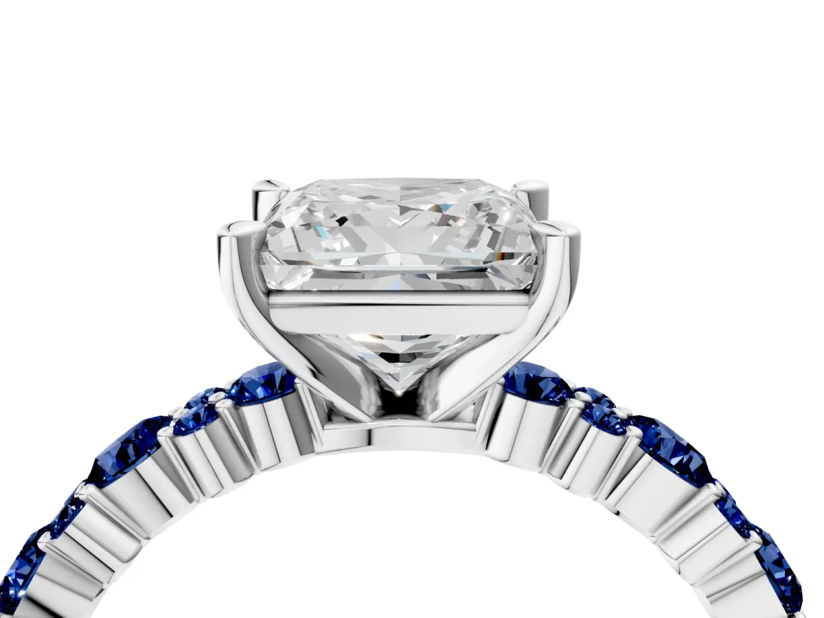 Princess Cut Diamond Side Stone Solitaire Ring with Round Blue Sapphire and Four-Prong Setting Platinum