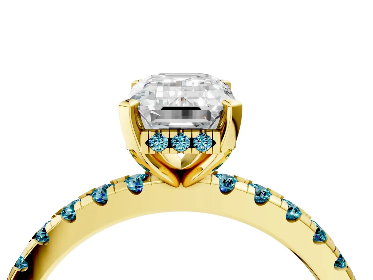 Emerald Cut Diamond Solitaire Ring with Round Blue Topaz Pavé Band and Four-Prong Setting Yellow gold