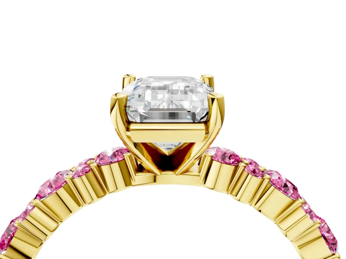 Emerald Cut Diamond Side Stone Solitaire Ring with Round Pink Sapphire and Four-Prong Setting Yellow gold