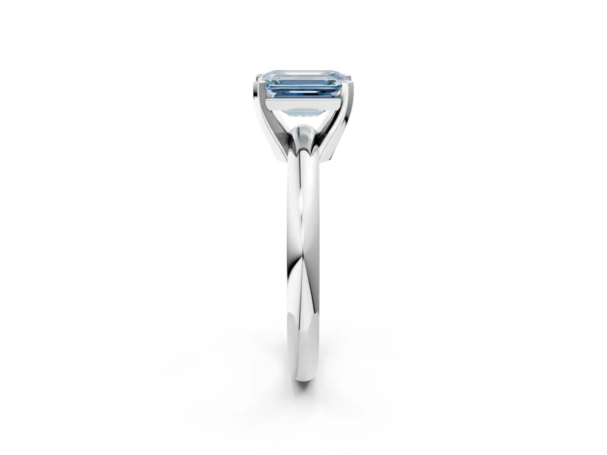 Fancy Blue Emerald Cut Diamond Solitaire Engagement Ring with Round Band and Four-Prong Setting White gold