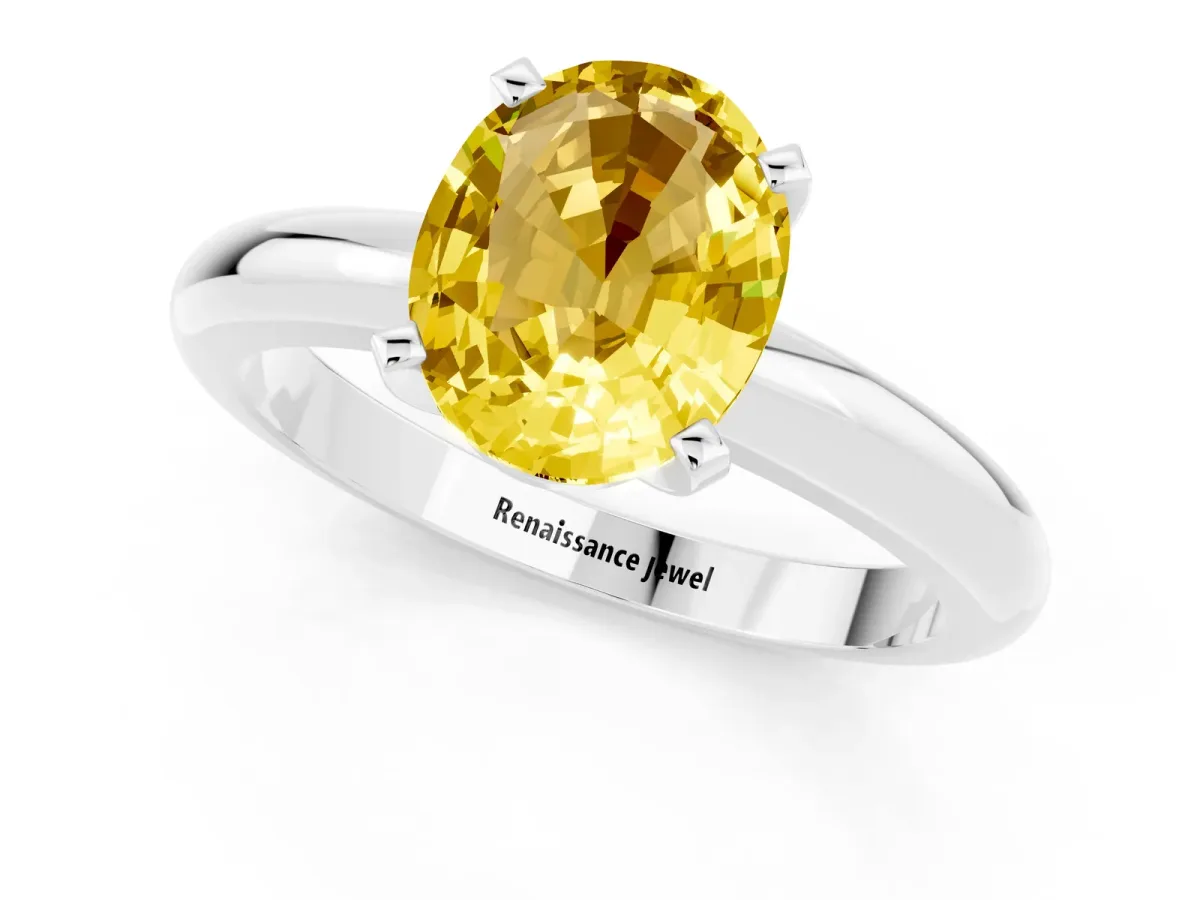 Oval Cut Yellow Sapphire Solitaire Engagement Ring with Round Band and Four-Prong Setting Silver