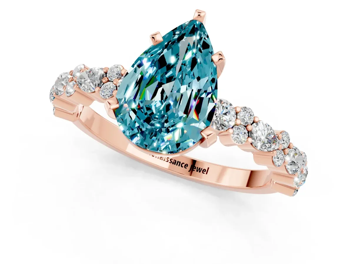 Pear Cut Blue Topaz Side Stone Solitaire Ring with Round and Four-Prong Setting Rose gold
