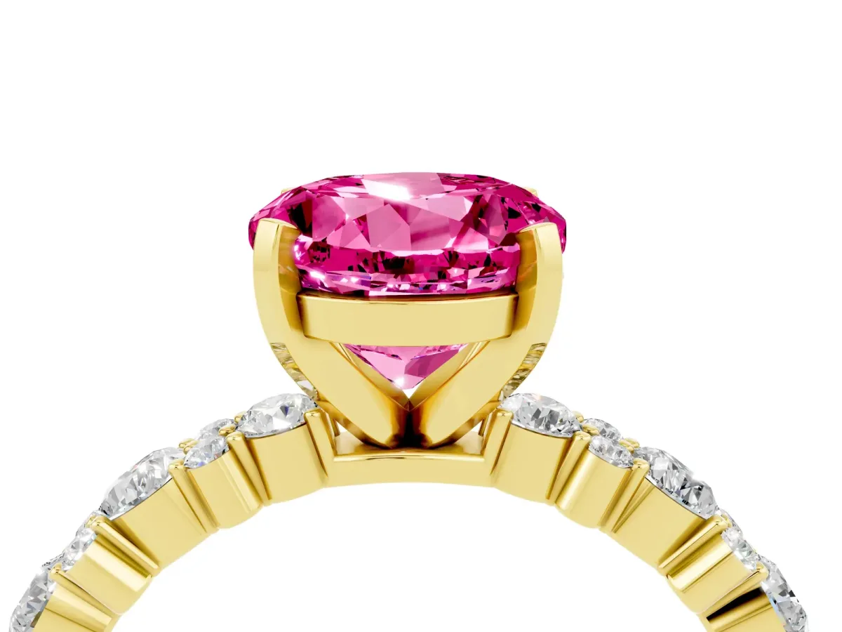 Round Cut Pink Sapphire Side Stone Solitaire Ring with Round and Four-Prong Setting Yellow gold