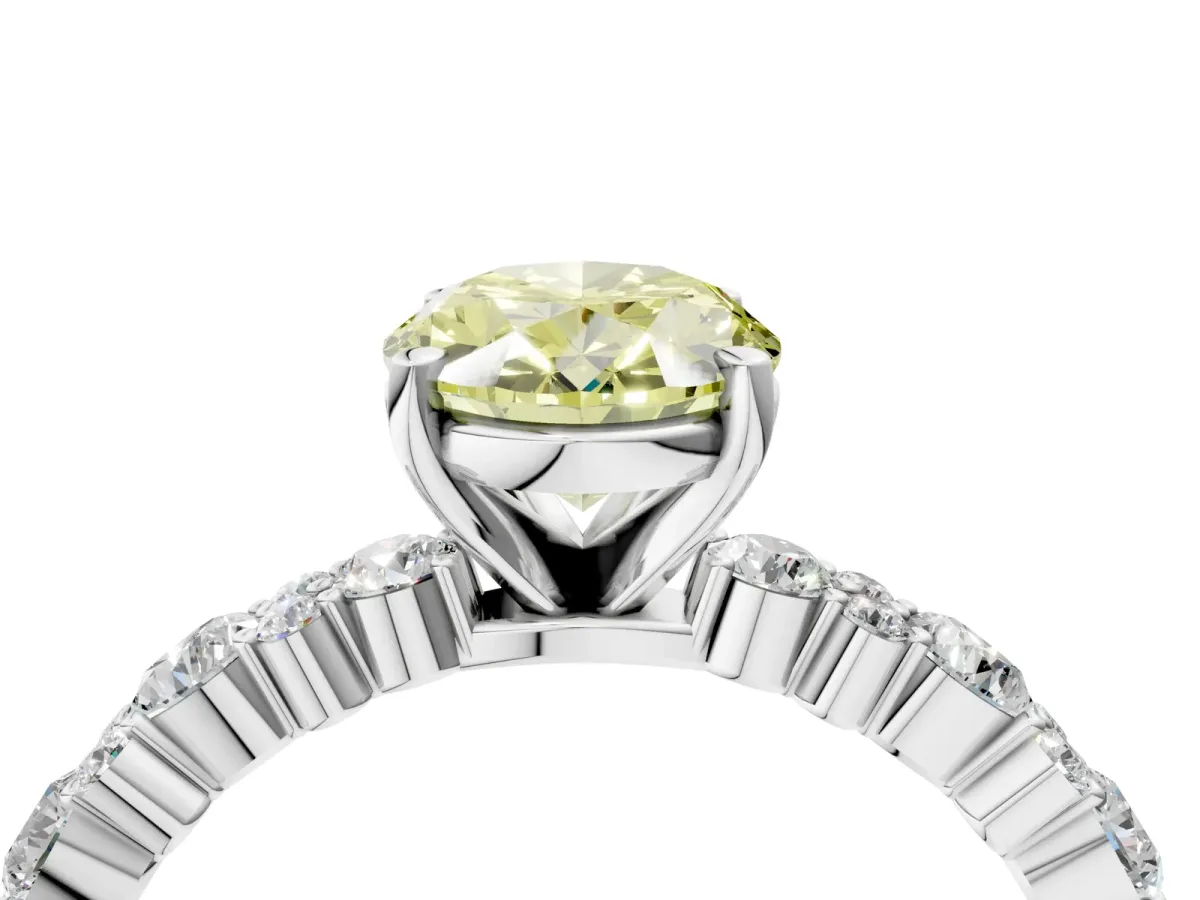 Fancy Yellow Oval Cut Diamond Side Stone Solitaire Ring with Round and Four-Prong Setting Platinum