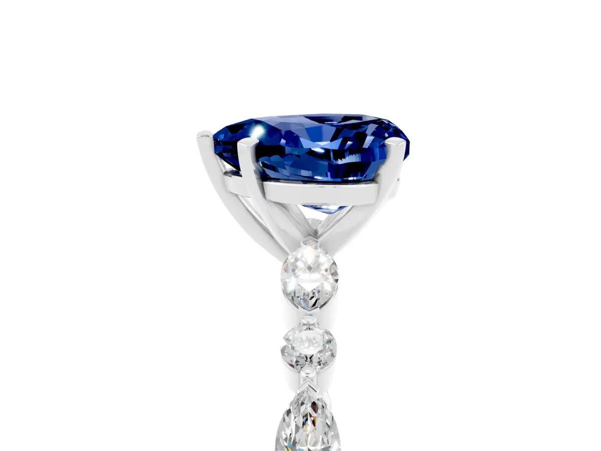 Heart Cut Blue Sapphire Ring with Marquise and Round Side Stones and Four-Prong Setting Silver
