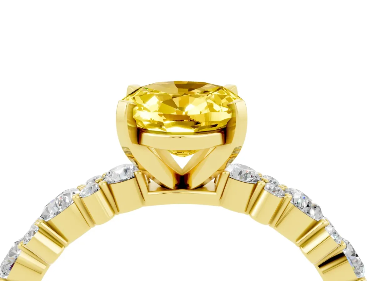 Oval Cut Yellow Sapphire Side Stone Solitaire Ring with Round and Four-Prong Setting Yellow gold