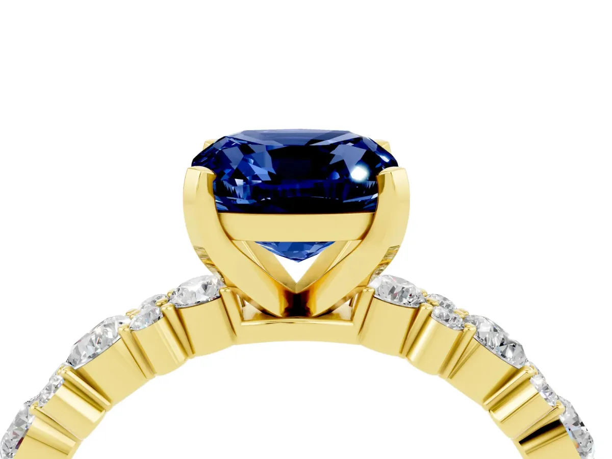 Cushion Cut Blue Sapphire Side Stone Solitaire Ring with Round and Four-Prong Setting Yellow gold