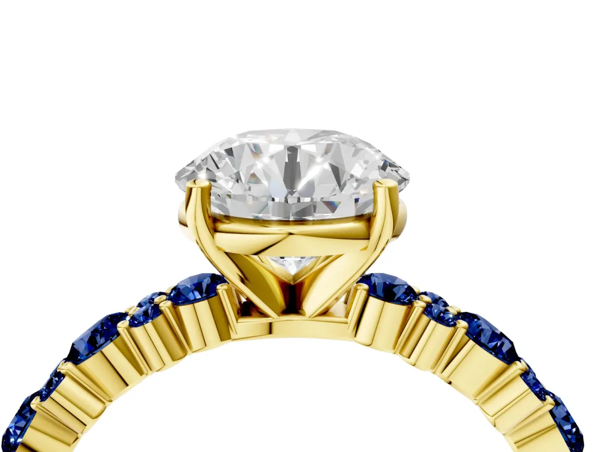 Round Cut Diamond Side Stone Solitaire Ring with Round Blue Sapphire and Four-Prong Setting Yellow gold