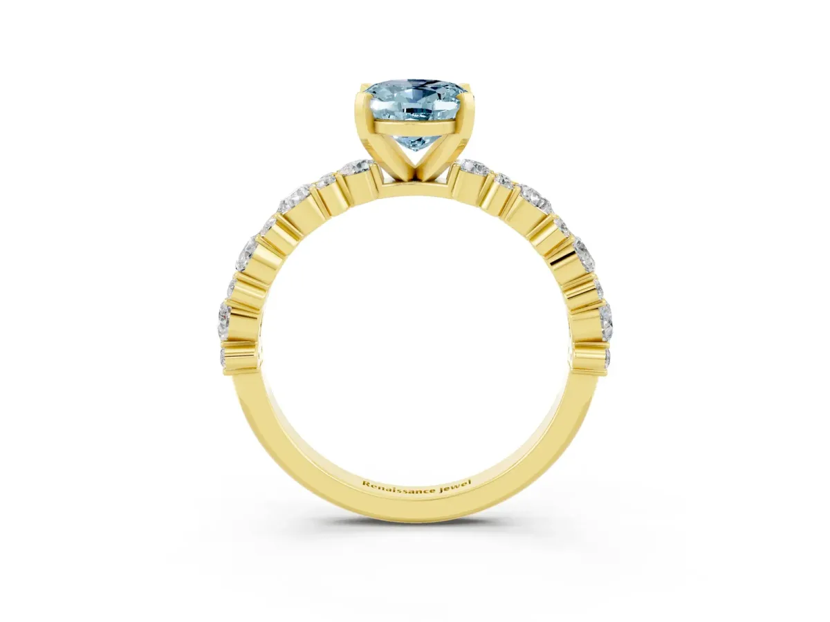 Oval Cut Aquamarine Side Stone Solitaire Ring with Round and Four-Prong Setting Yellow gold