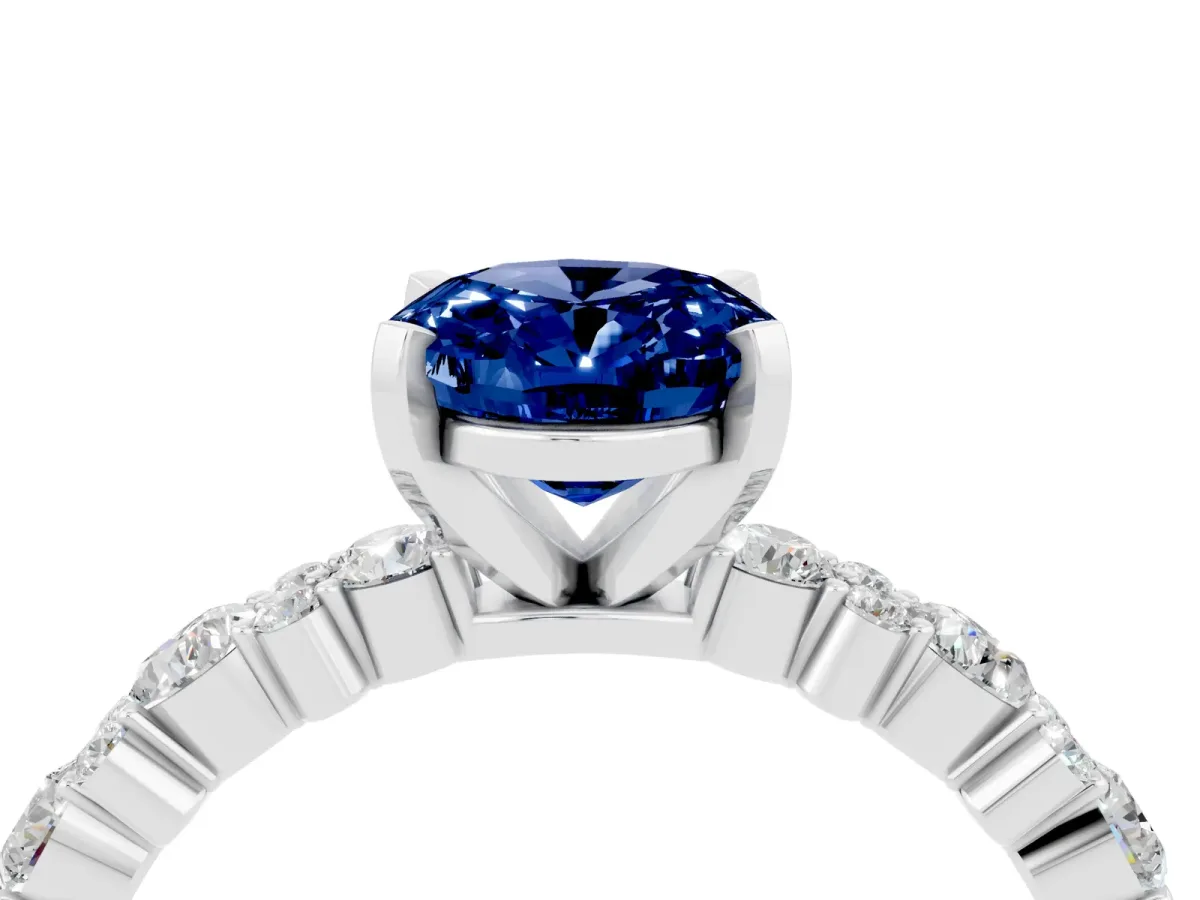 Oval Cut Blue Sapphire Side Stone Solitaire Ring with Round and Four-Prong Setting White gold