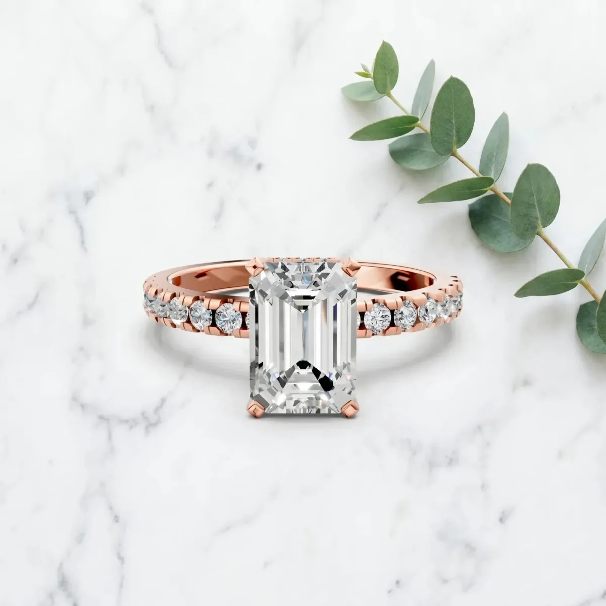 Emerald Cut Diamond Solitaire Ring with Round Pavé Band and Four-Prong Setting Rose gold