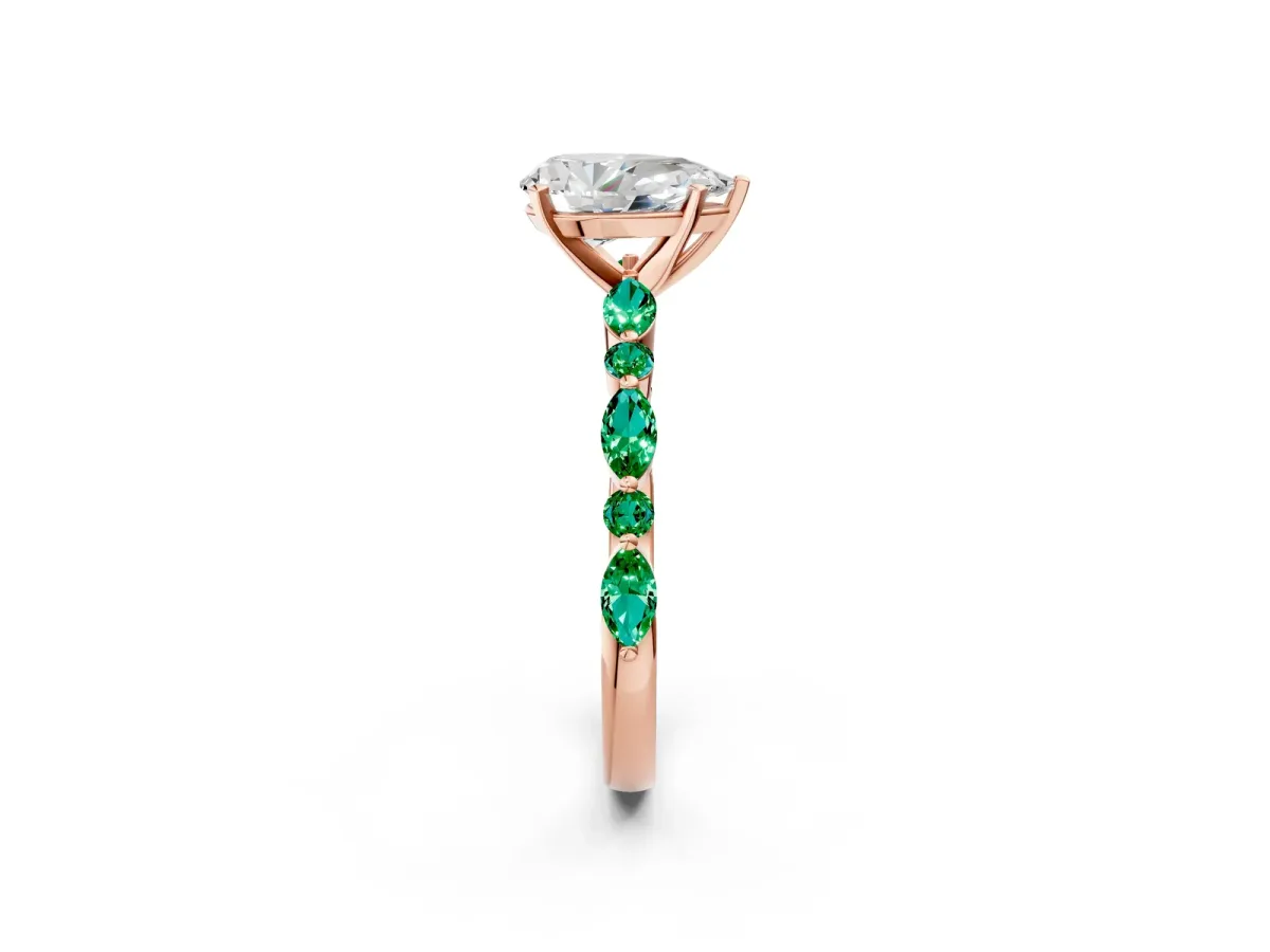 Pear Cut Diamond Ring with Marquise and Round Emerald Side Stones and Four-Prong Setting Rose gold