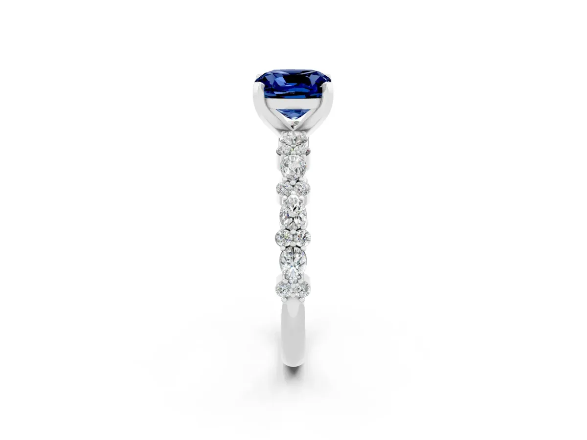 Cushion Cut Blue Sapphire Side Stone Solitaire Ring with Round and Four-Prong Setting Platinum