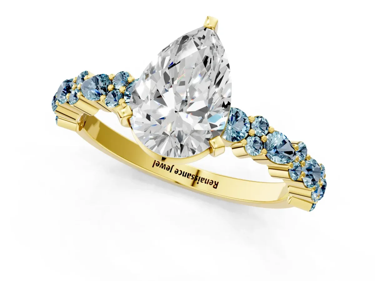 Pear Cut Diamond Side Stone Solitaire Ring with Round Aquamarine and Four-Prong Setting Yellow gold