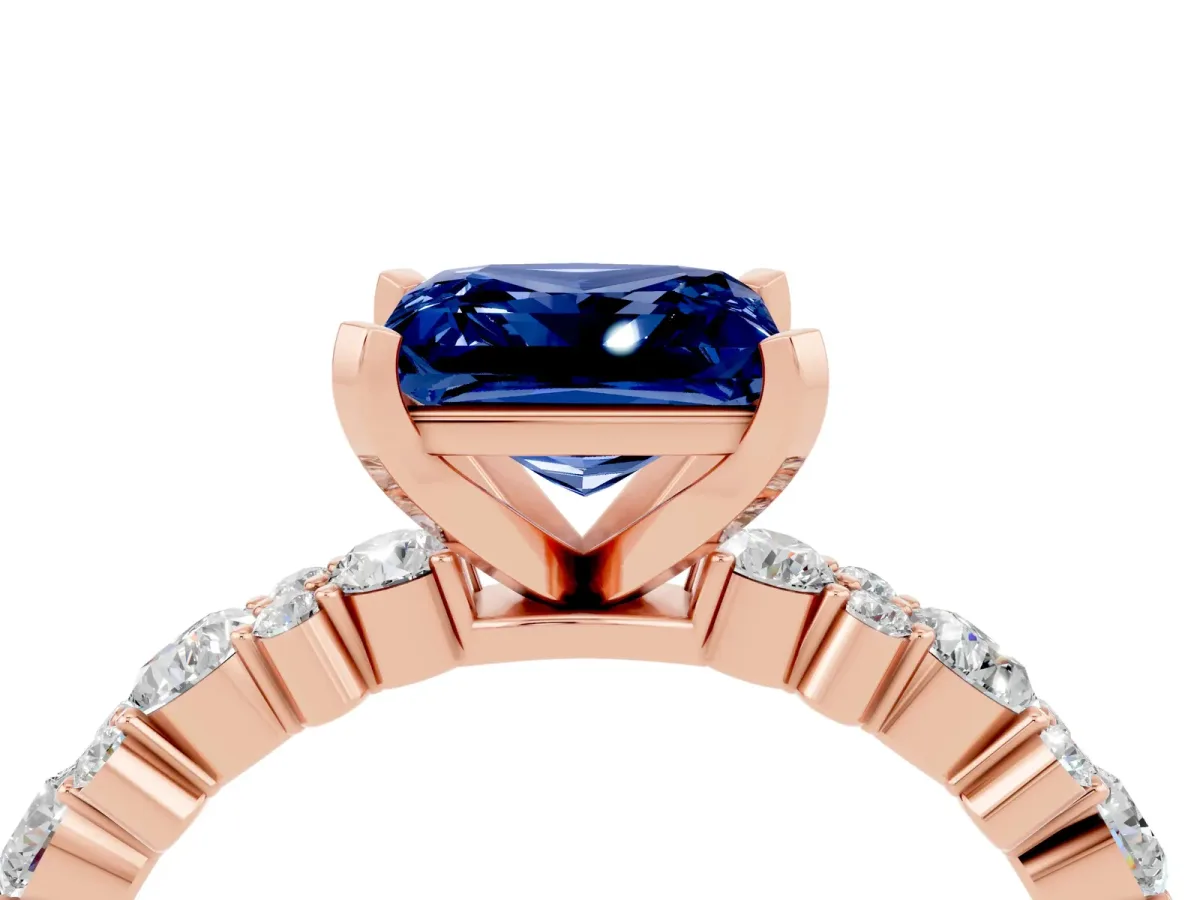 Princess Cut Blue Sapphire Side Stone Solitaire Ring with Round and Four-Prong Setting Rose gold