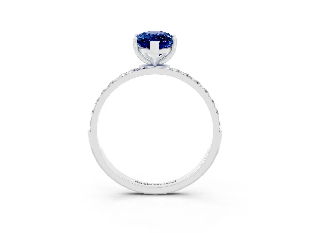 Marquise Cut Blue Sapphire Solitaire Ring with Round Pavé Band and Prong Setting Silver