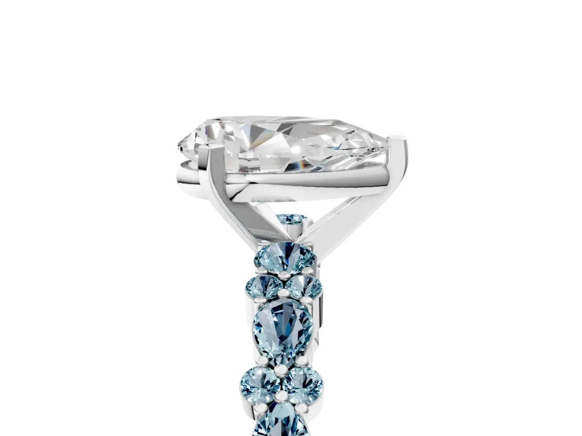 Pear Cut Diamond Side Stone Solitaire Ring with Round Aquamarine and Four-Prong Setting White gold