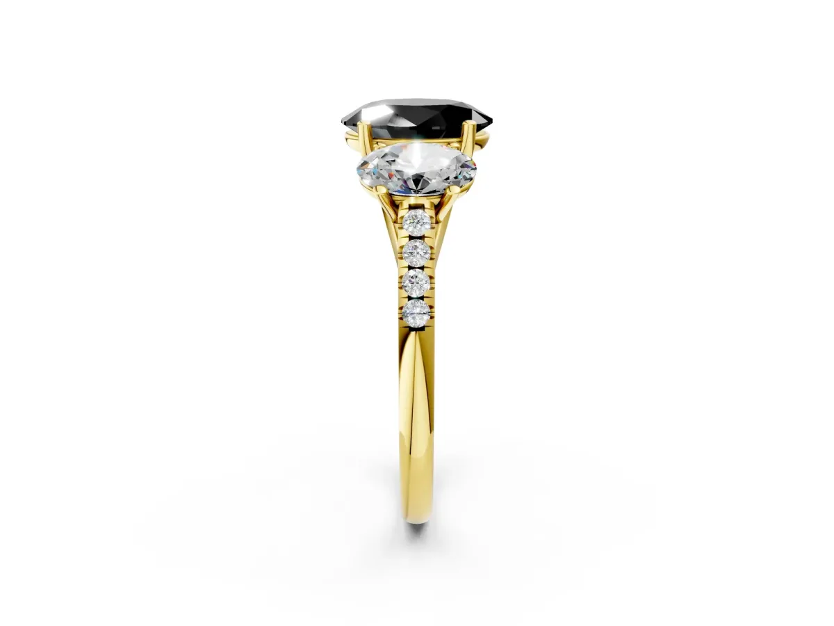 Fancy Black Three-Stone Oval Cut Diamond Ring with Round Pavé Band and Prong Setting Yellow gold