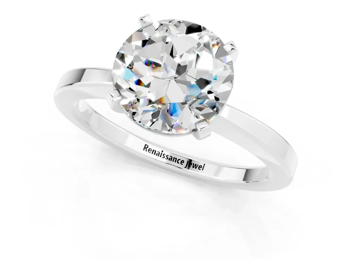 Round Cut Moissanite Solitaire Engagement Ring with Classic Band and Four-Prong Setting Silver