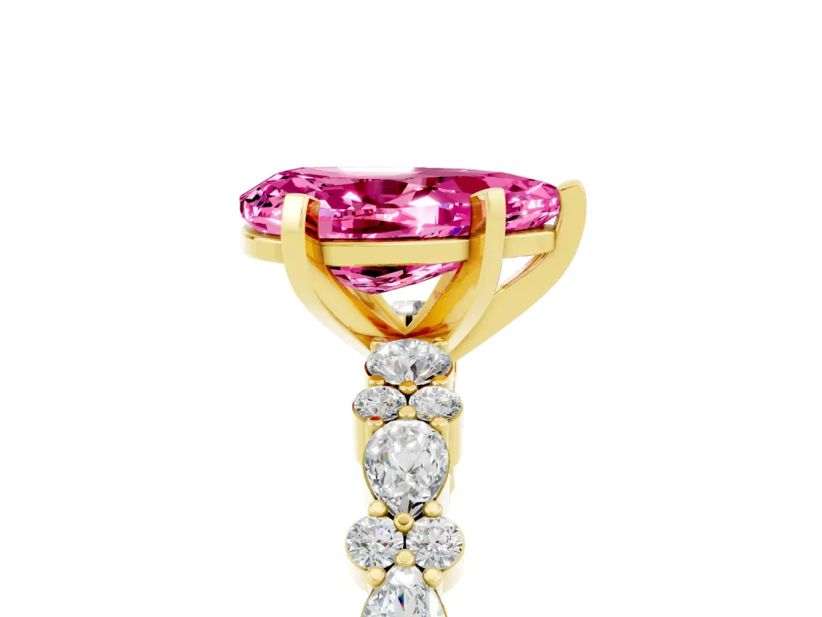 Pear Cut Pink Sapphire Side Stone Solitaire Ring with Round and Four-Prong Setting Yellow gold