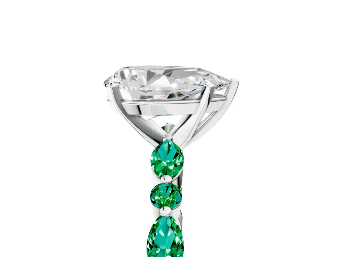 Pear Cut Diamond Ring with Marquise and Round Emerald Side Stones and Four-Prong Setting Silver