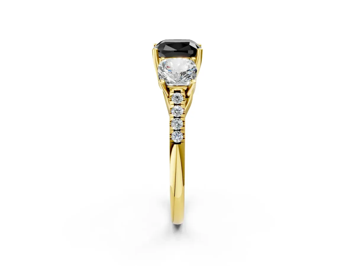 Fancy Black Three-Stone Cushion Cut Diamond Ring with Round Pavé Band and Prong Setting Yellow gold