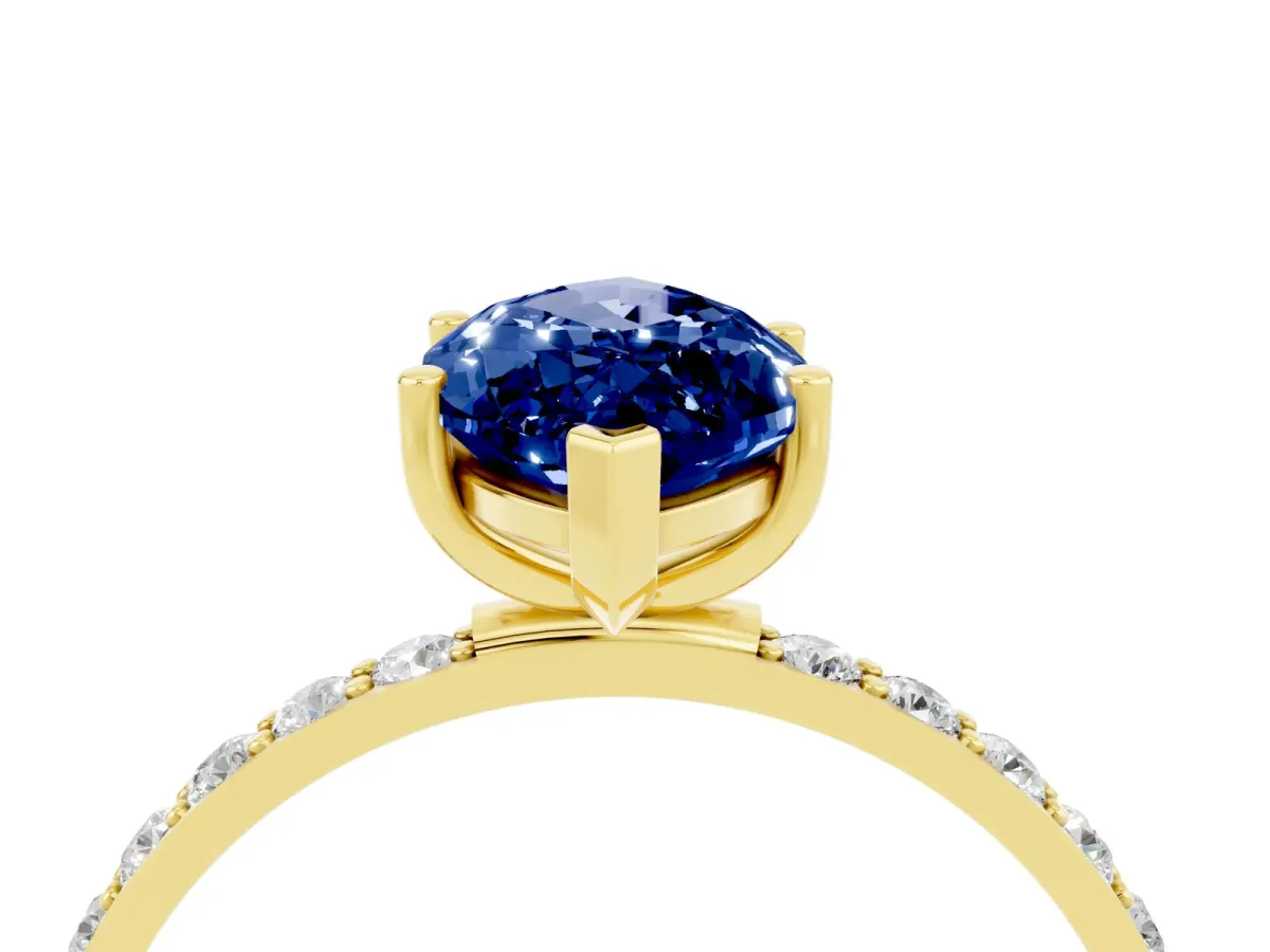 Marquise Cut Blue Sapphire Solitaire Ring with Round Pavé Band and Prong Setting Yellow gold