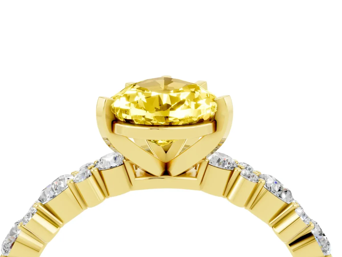 Pear Cut Yellow Sapphire Side Stone Solitaire Ring with Round and Four-Prong Setting Yellow gold