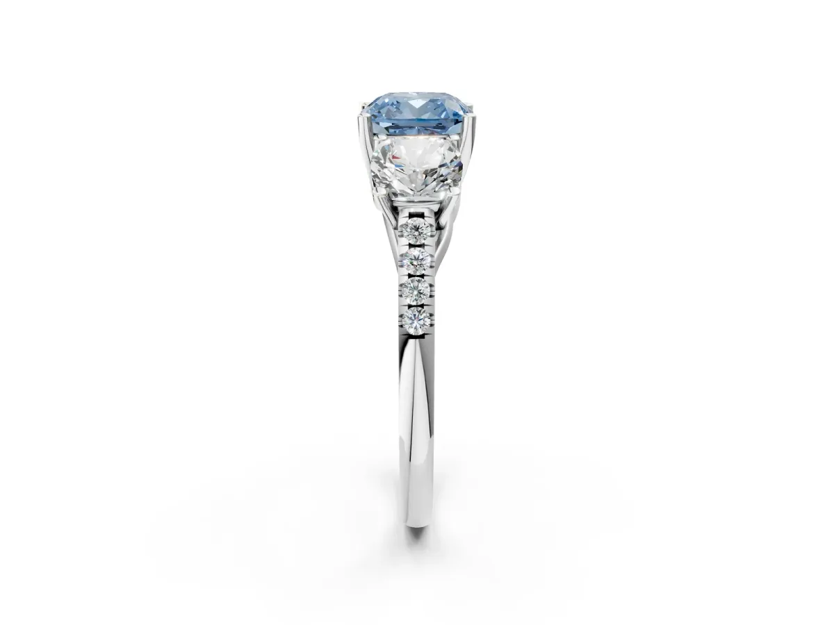Fancy Blue Three-Stone Cushion Cut Diamond Ring with Round Pavé Band and Prong Setting White gold