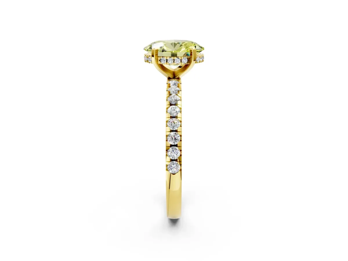 Fancy Yellow Oval Cut Diamond Solitaire Ring with Round Pavé Band and Four-Prong Setting Yellow gold