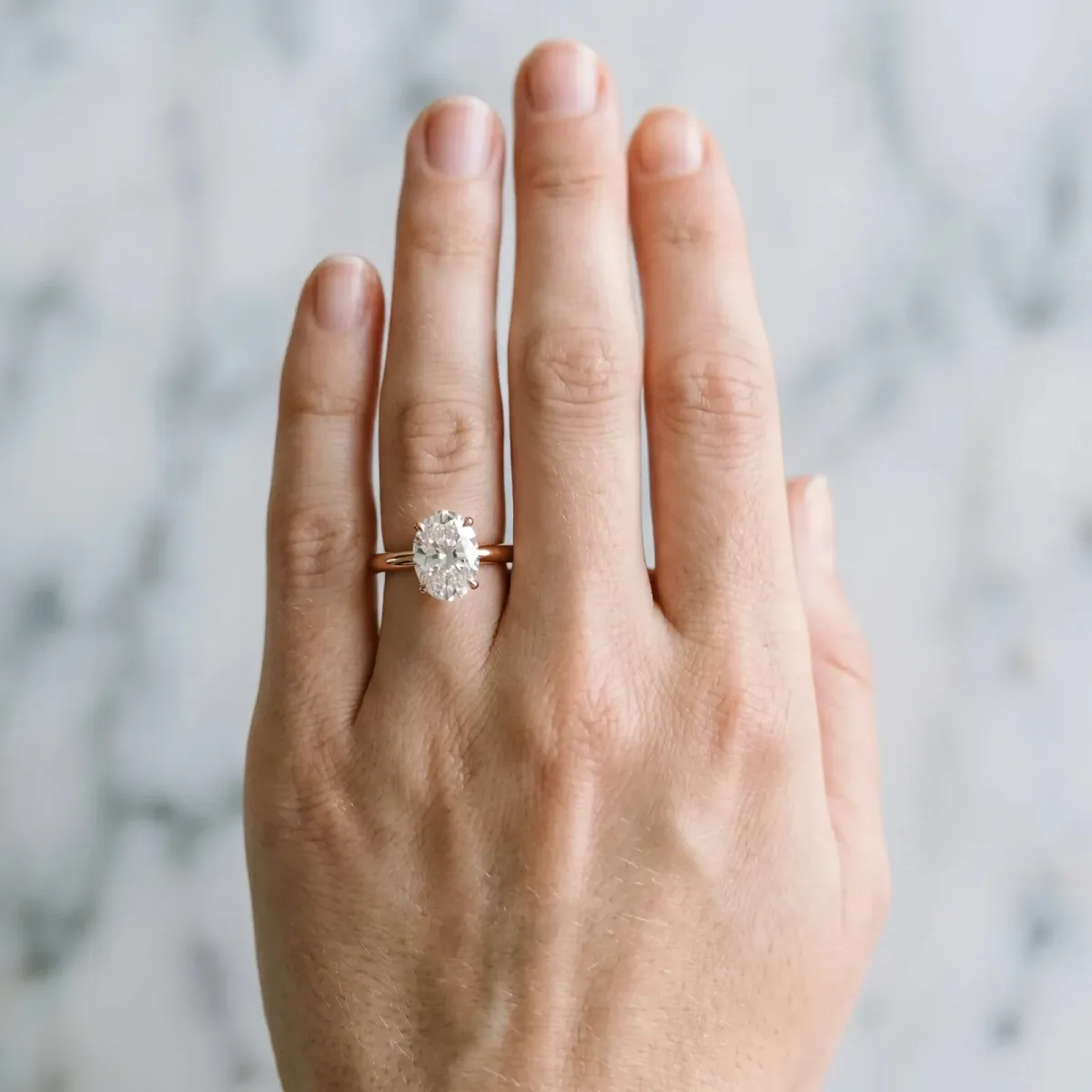Oval Cut Diamond Solitaire Engagement Ring with Classic Band and Four-Prong Setting Rose gold