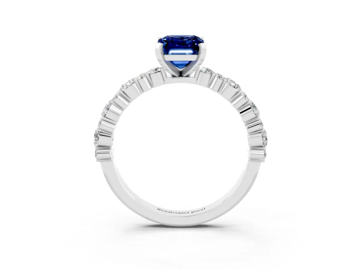 Emerald Cut Blue Sapphire Side Stone Solitaire Ring with Round and Four-Prong Setting White gold