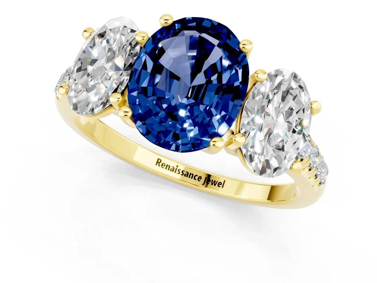 Three-Stone Oval Cut Blue Sapphire Ring with Round Pavé Band and Prong Setting Yellow gold