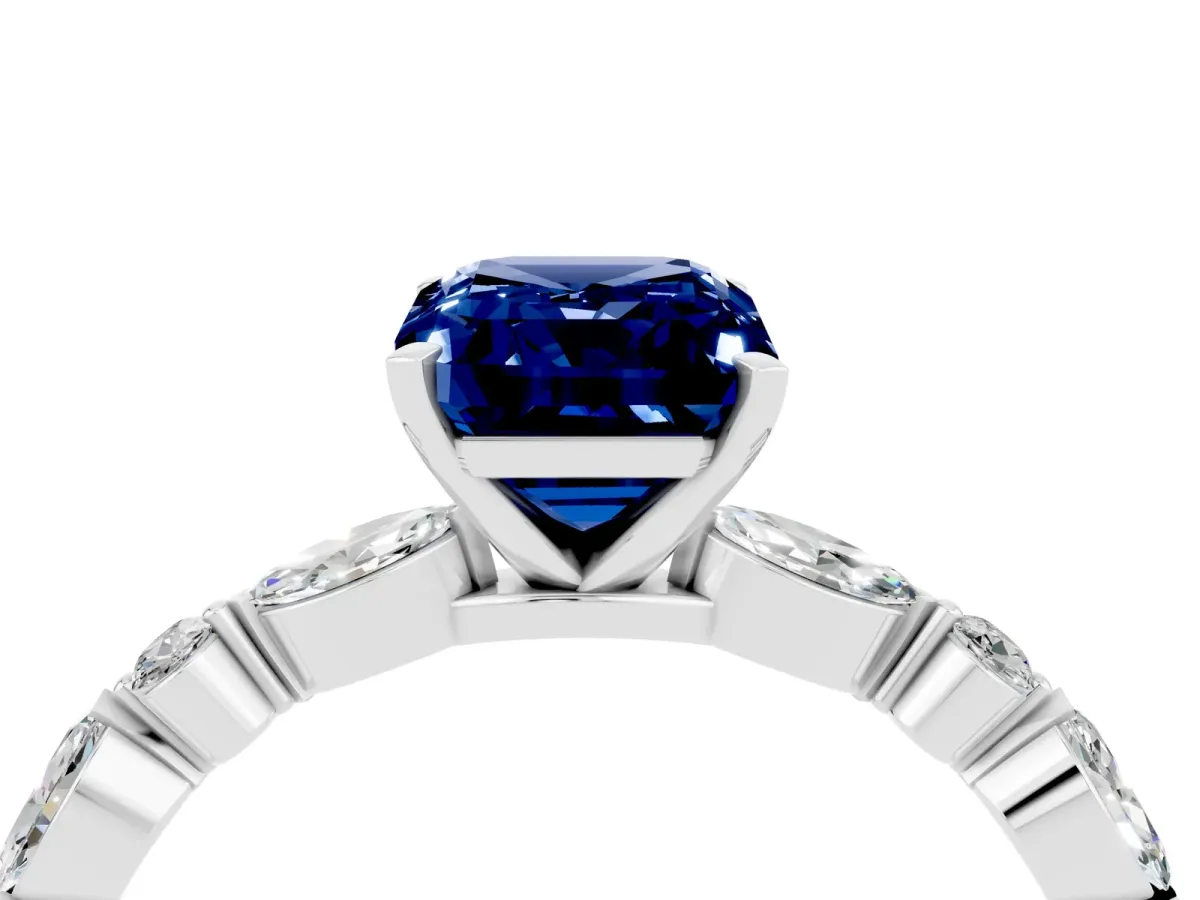 Emerald Cut Blue Sapphire Ring with Marquise and Round Side Stones and Four-Prong Setting Silver