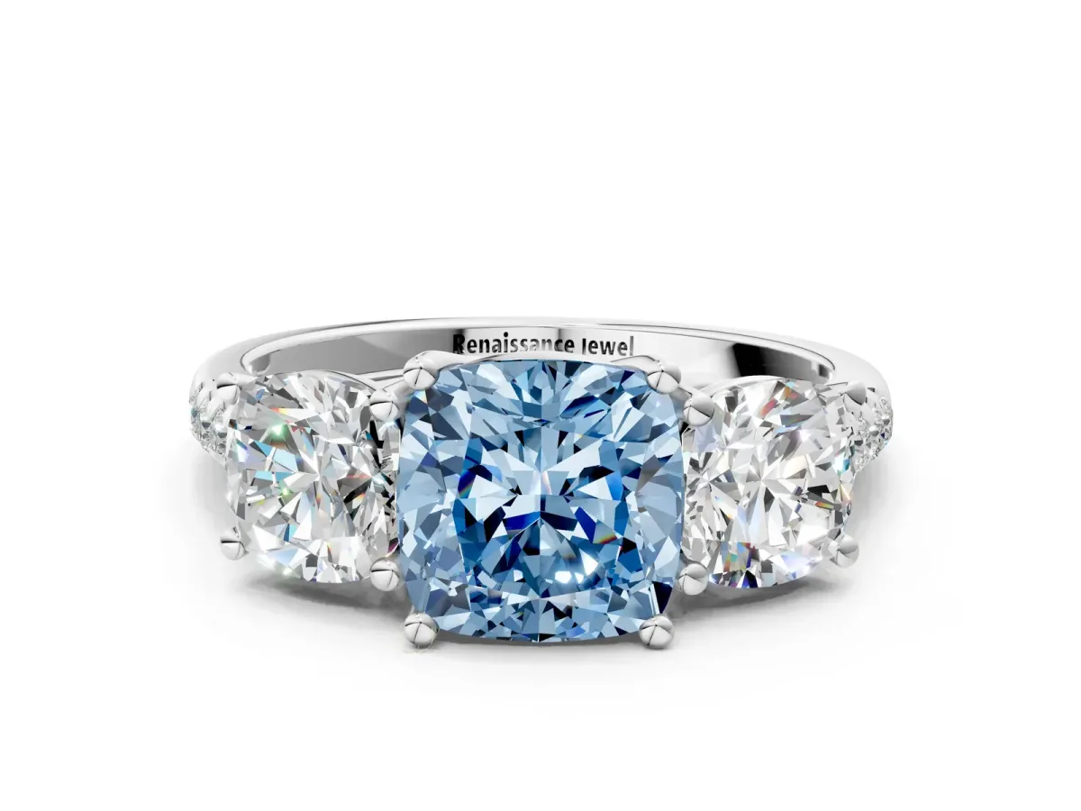 Fancy Blue Three-Stone Cushion Cut Diamond Ring with Round Pavé Band and Prong Setting White gold
