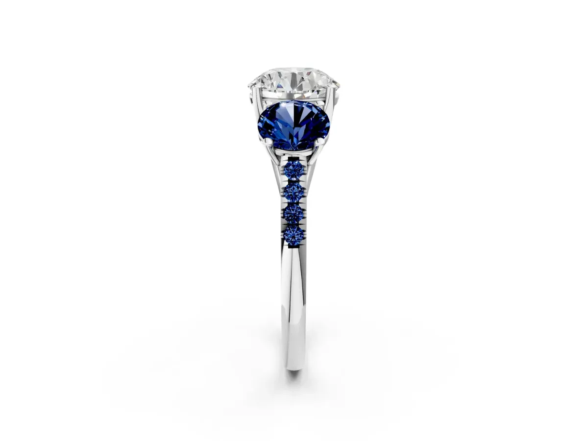 Three-Stone Round Cut Diamond Ring with Round Blue Sapphire Pavé Band and Prong Setting White gold