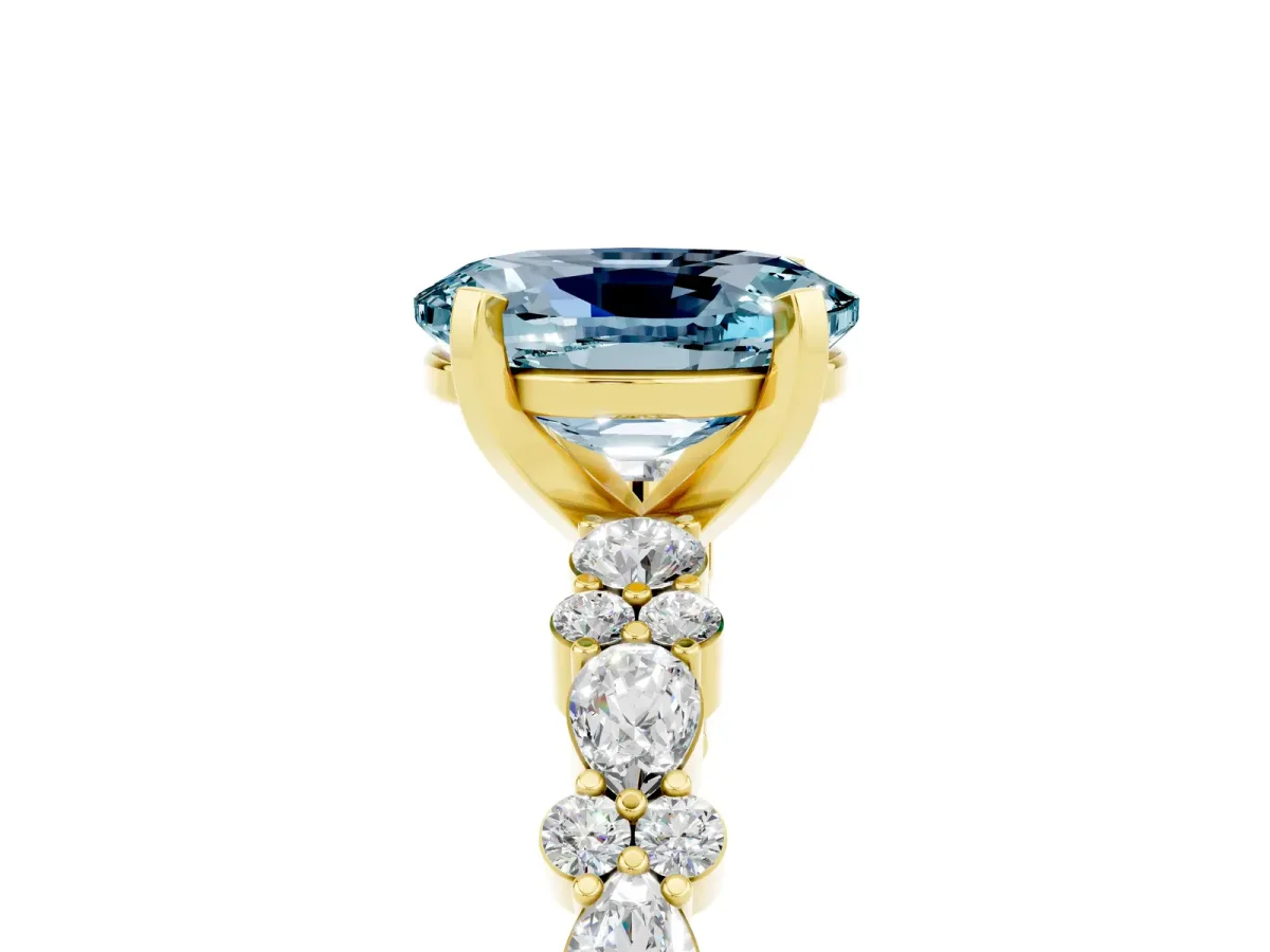 Oval Cut Aquamarine Side Stone Solitaire Ring with Round and Four-Prong Setting Yellow gold