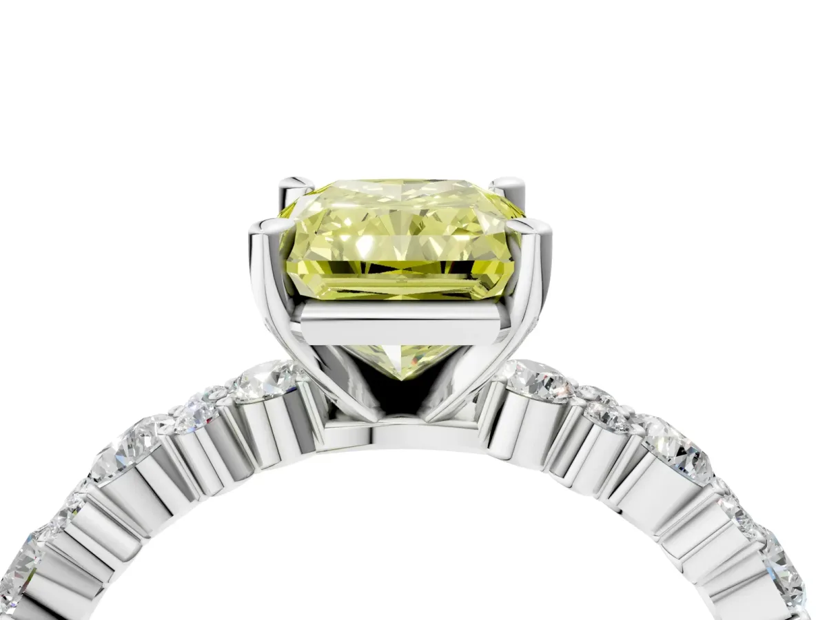 Fancy Yellow Radiant Cut Diamond Side Stone Solitaire Ring with Round and Four-Prong Setting Platinum