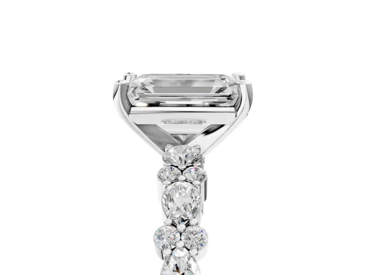 Emerald Cut Diamond Side Stone Solitaire Ring with Round and Four-Prong Setting White gold