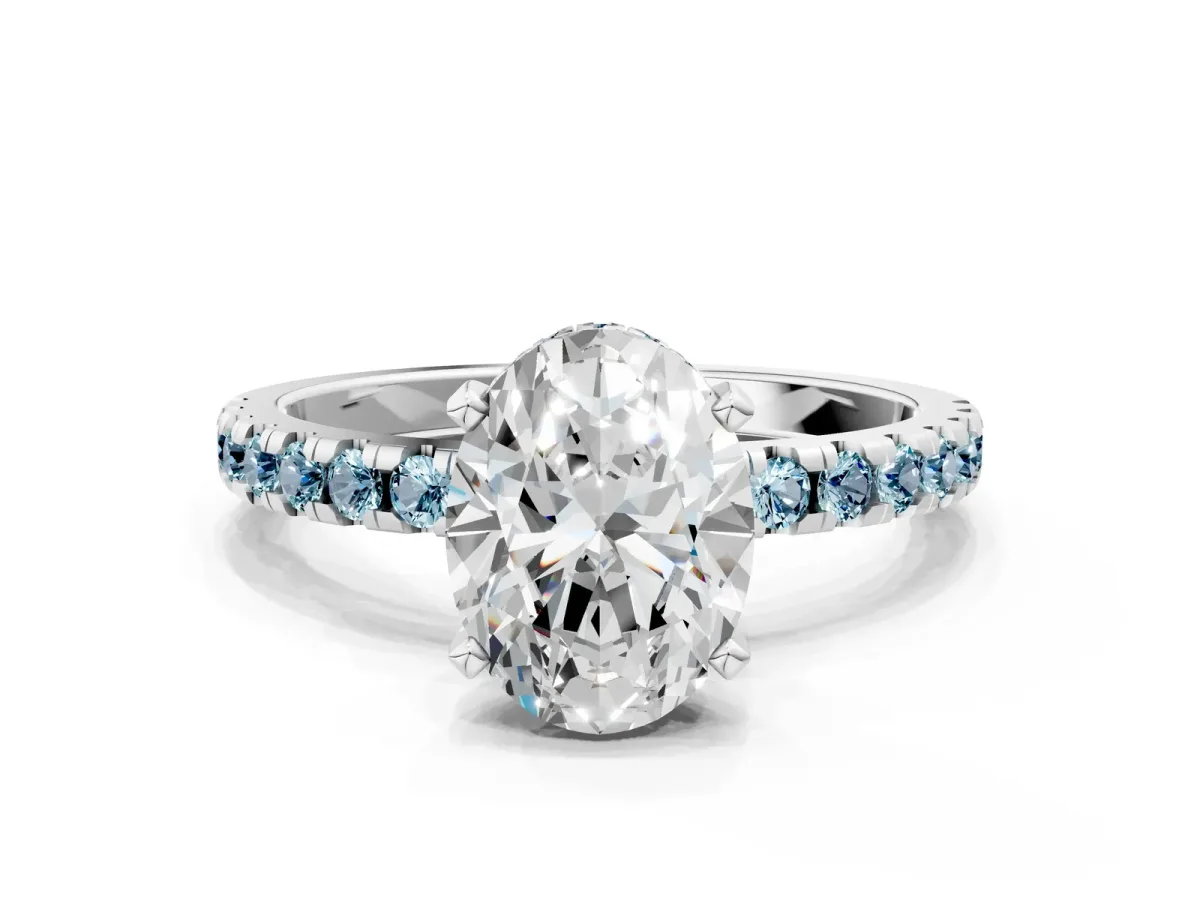 Oval Cut Diamond Solitaire Ring with Round Aquamarine Pavé Band and Four-Prong Setting Silver