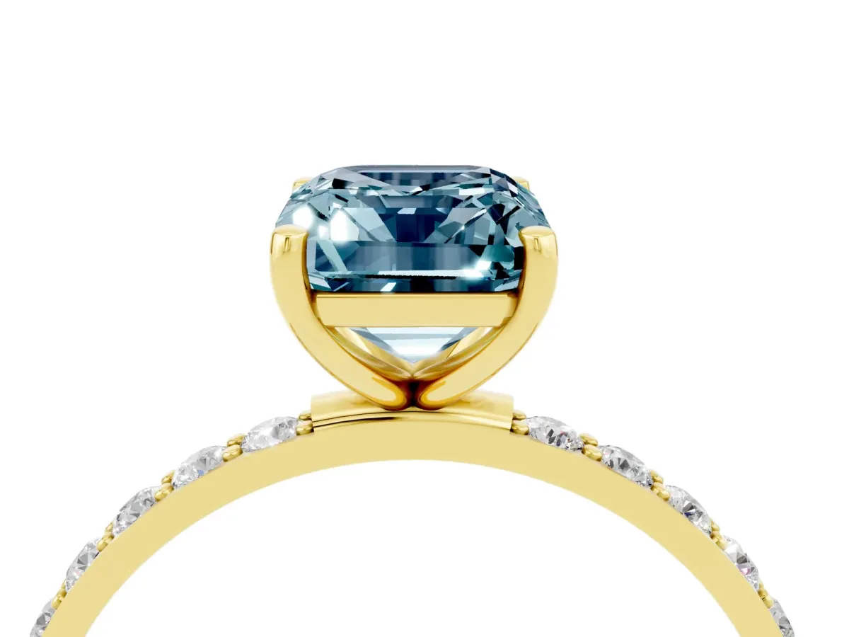 Emerald Cut Aquamarine Solitaire Ring with Round Pavé Band and Prong Setting Yellow gold