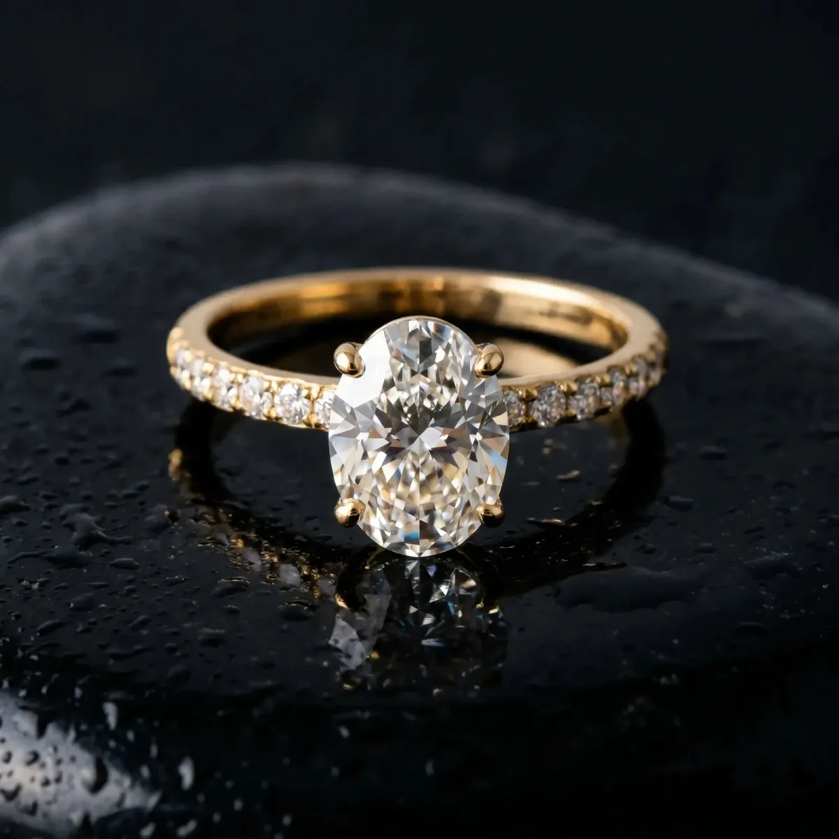 Oval Cut Diamond Solitaire Ring with Round Pavé Band and Prong Setting Yellow gold
