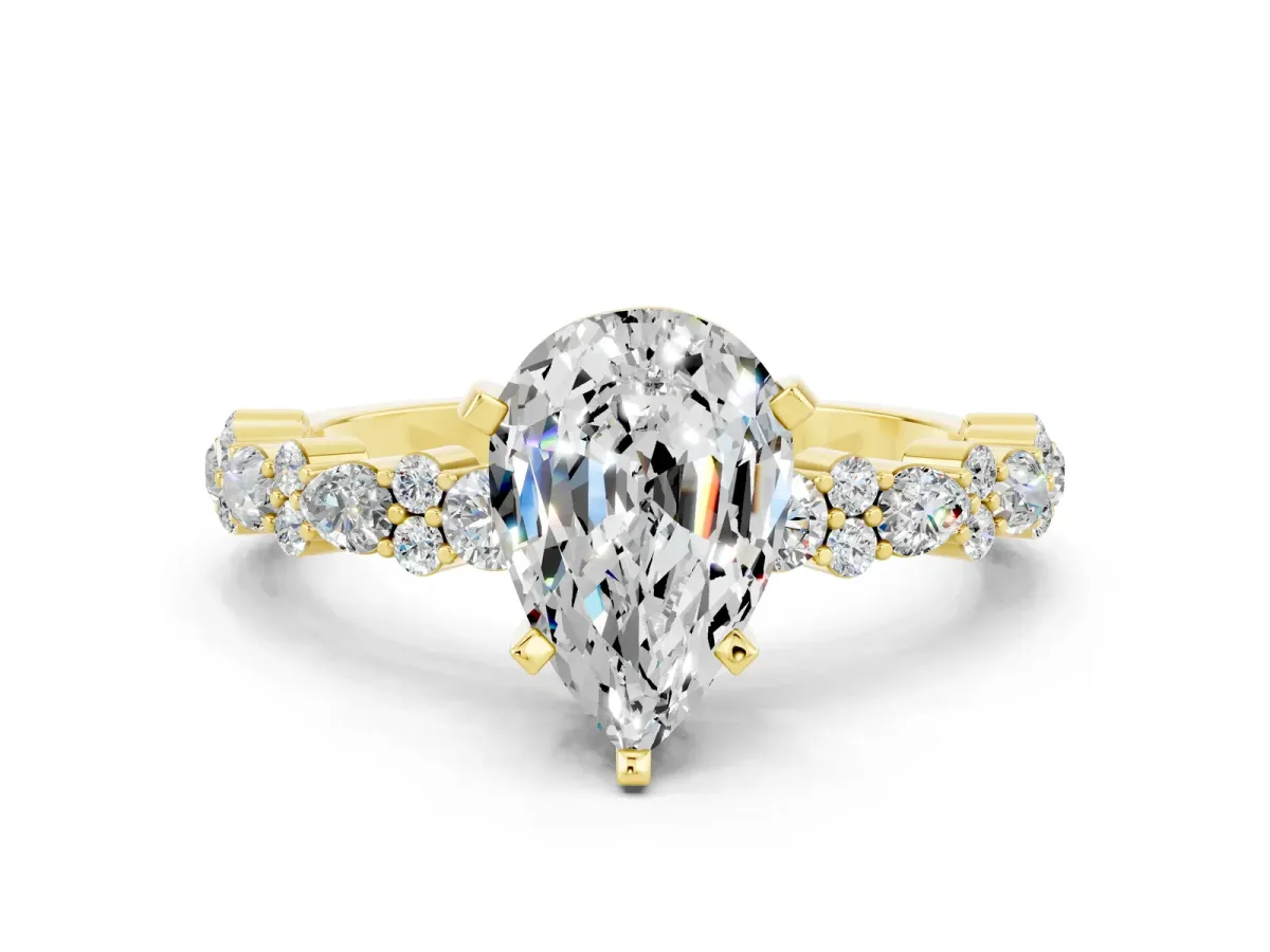 Pear Cut Moissanite Side Stone Solitaire Ring with Round and Four-Prong Setting Yellow gold