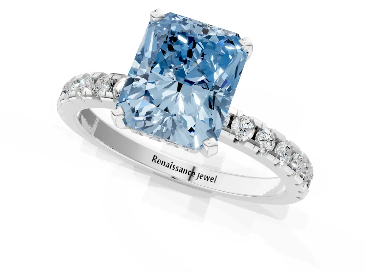 Fancy Blue Radiant Cut Diamond Solitaire Ring with Round Pavé Band and Four-Prong Setting Silver