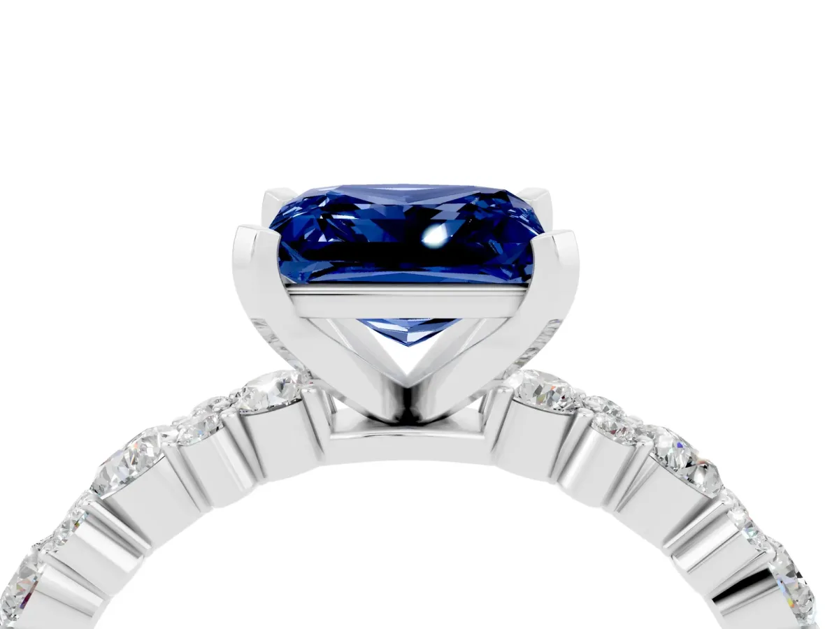 Princess Cut Blue Sapphire Side Stone Solitaire Ring with Round and Four-Prong Setting Platinum