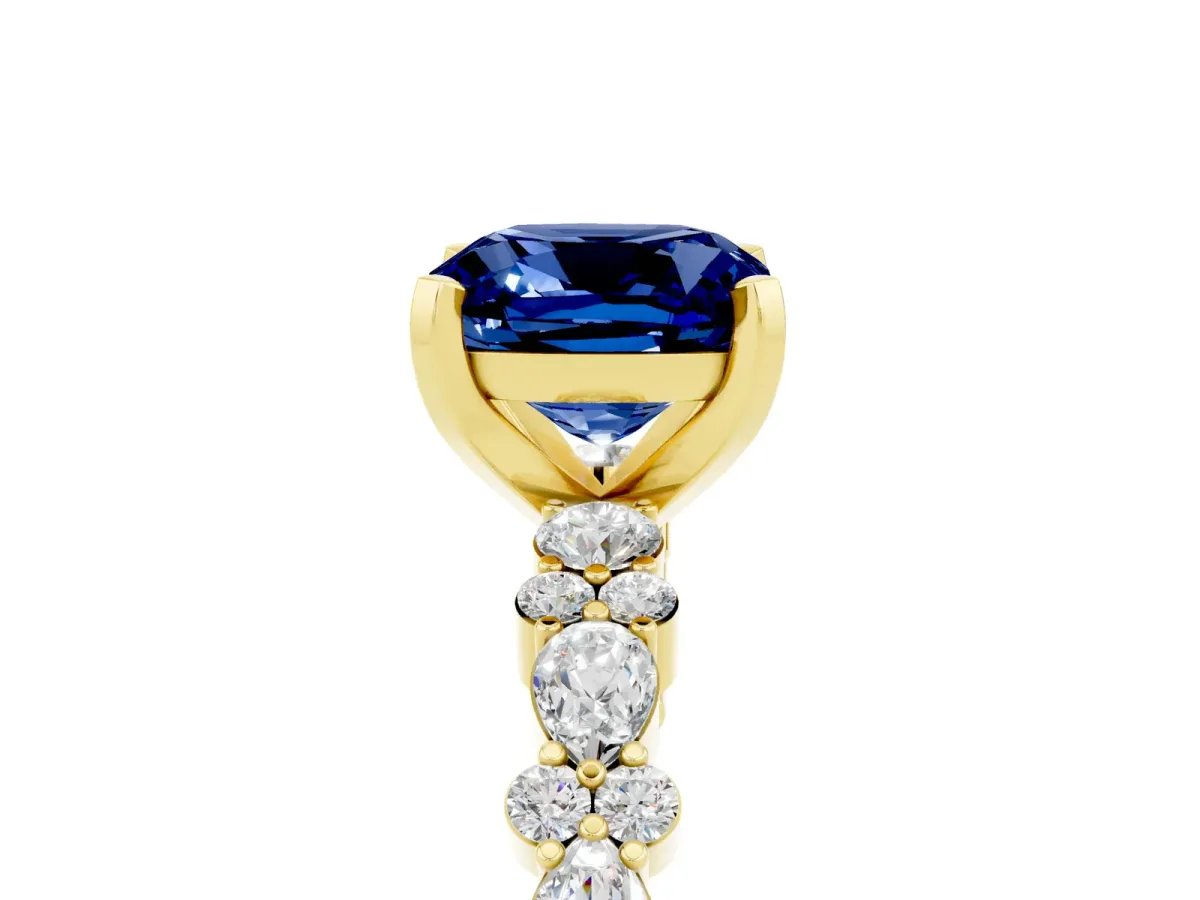 Cushion Cut Blue Sapphire Side Stone Solitaire Ring with Round and Four-Prong Setting Yellow gold