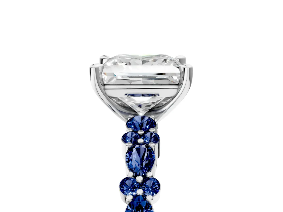 Princess Cut Diamond Side Stone Solitaire Ring with Round Blue Sapphire and Four-Prong Setting Platinum