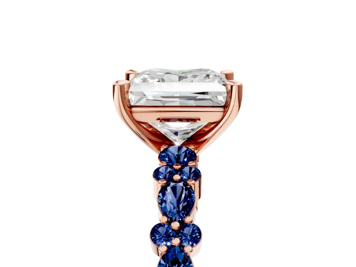Princess Cut Diamond Side Stone Solitaire Ring with Round Blue Sapphire and Four-Prong Setting Rose gold