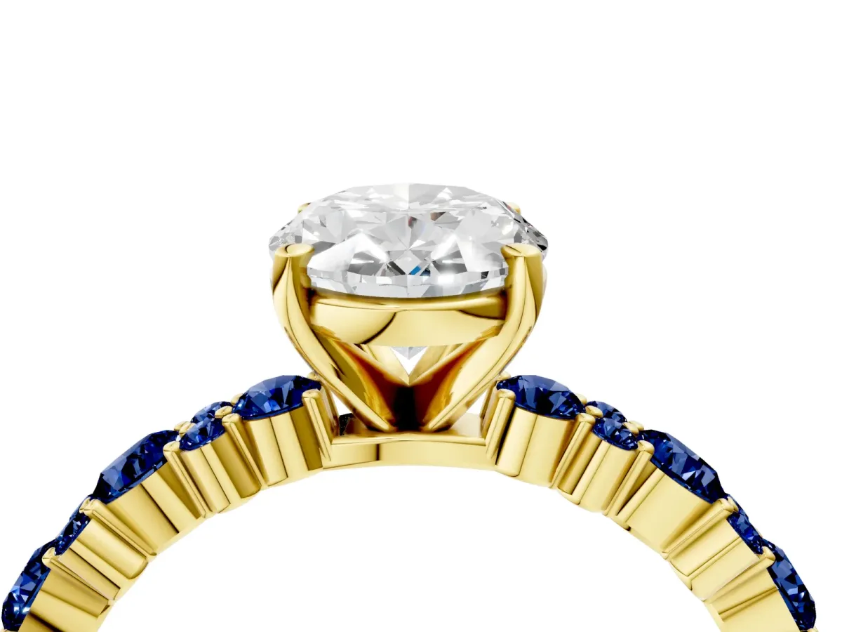 Oval Cut Diamond Side Stone Solitaire Ring with Round Blue Sapphire and Four-Prong Setting Yellow gold